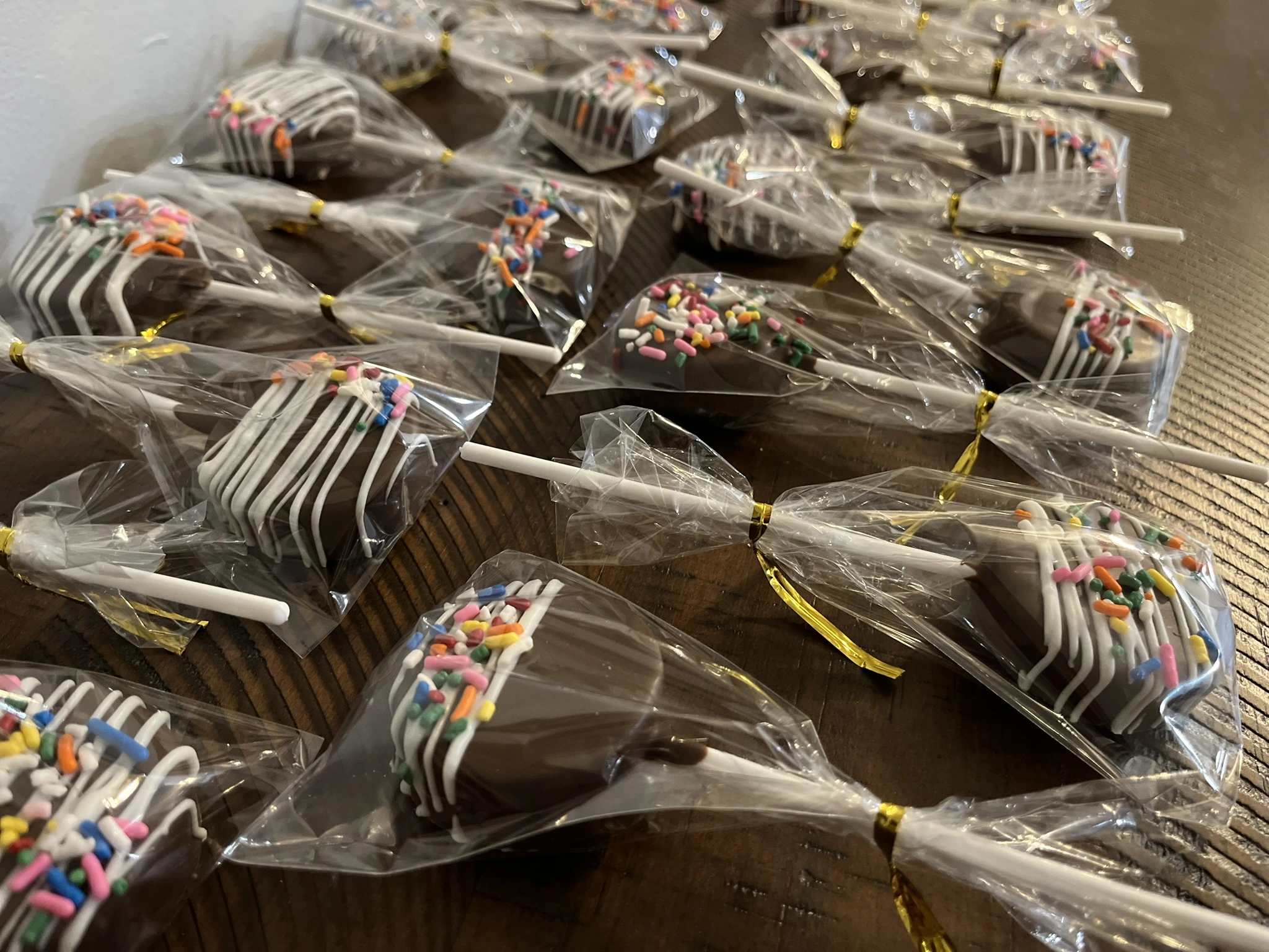 Gourmet Cake Pops dipped in gourmet chocolate and decorated with sprinkles